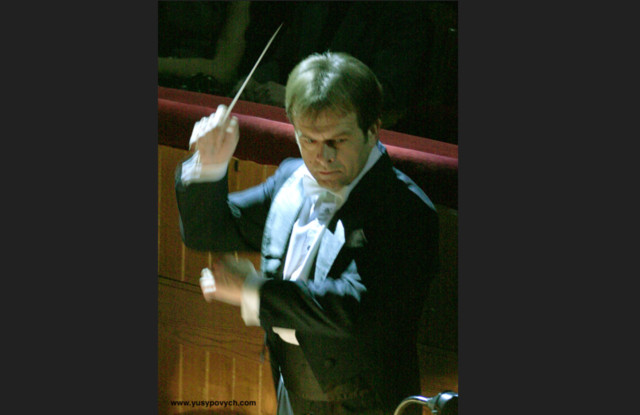 Orchestra Conductor with a Baton Stick